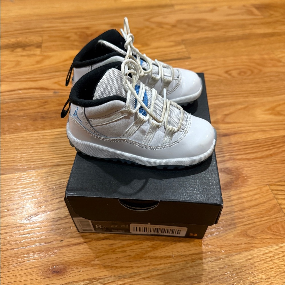 Jordan 11 Colombia White and Blue Sneakers
